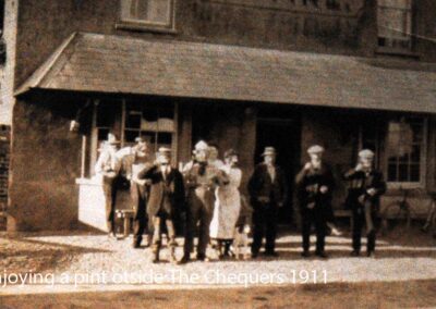 Enjoying a pint at the old Chequers (1911)